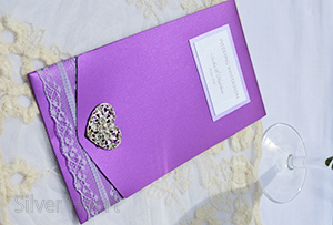 Passionate Purple pocketfold invitation, decorated with lace and large heart diamante embellishment. 