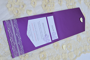 Passionate Purple pocketfold invitation, decorated with lace and large heart diamante embellishment. Open showing two inserts: RSVP and Invitation. 